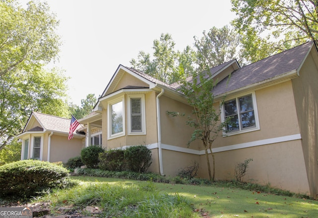 view of home's exterior featuring a lawn