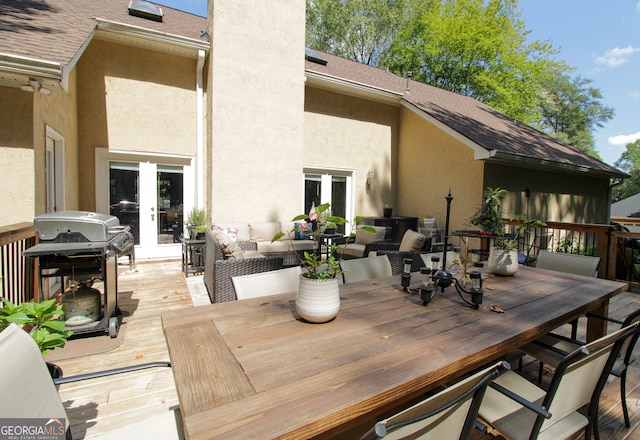 wooden deck featuring area for grilling, outdoor lounge area, and french doors