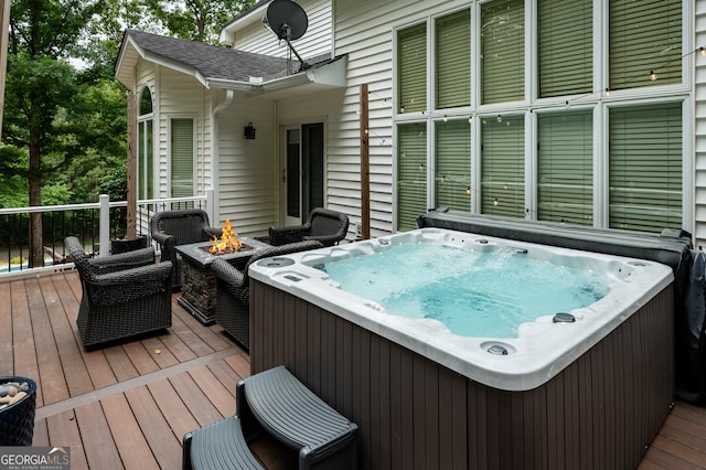 deck featuring a hot tub