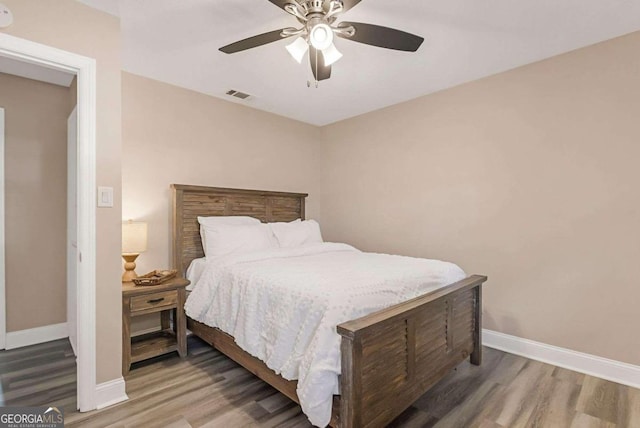 bedroom featuring wood-type flooring and ceiling fan