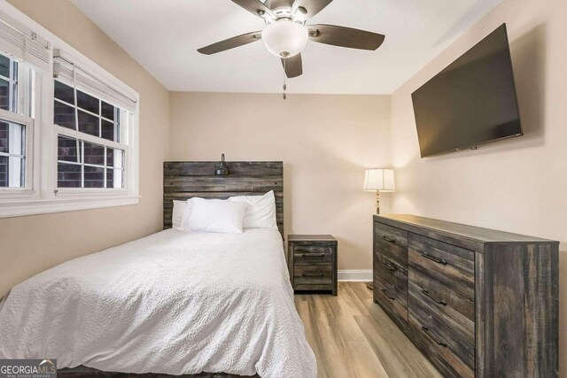 bedroom featuring ceiling fan and light hardwood / wood-style flooring