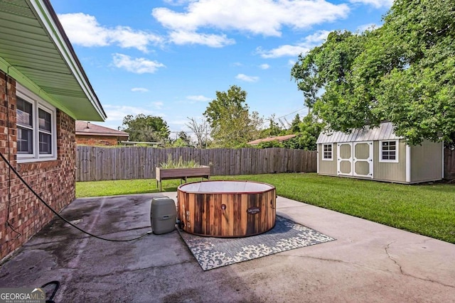 view of patio featuring a storage unit and a hot tub