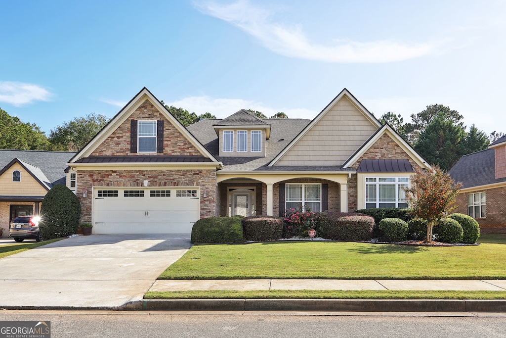 craftsman house featuring a front yard