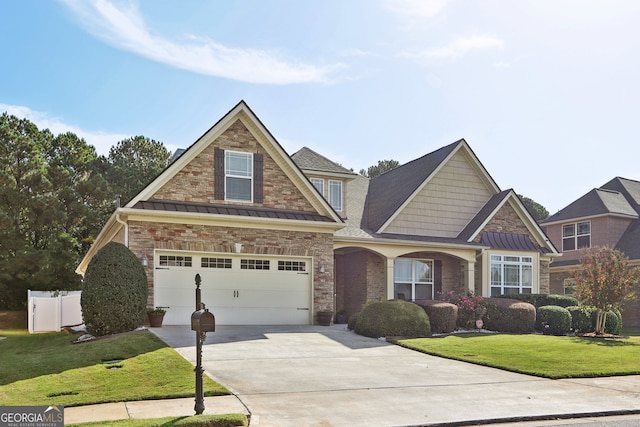 craftsman inspired home featuring a garage and a front lawn