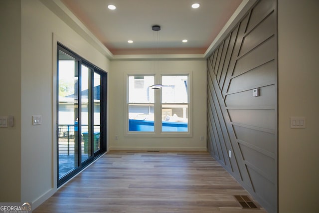 entryway with hardwood / wood-style floors