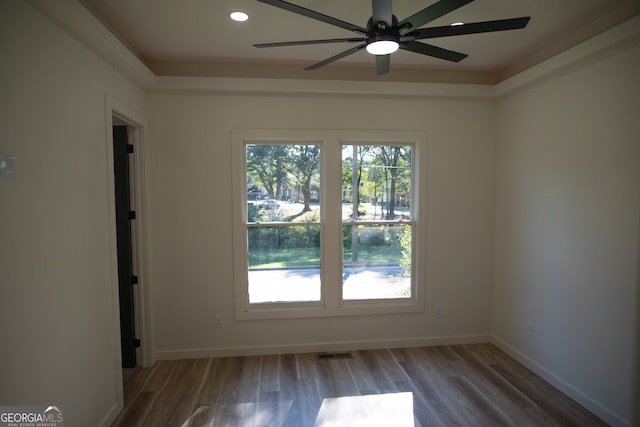 spare room with ceiling fan and hardwood / wood-style flooring