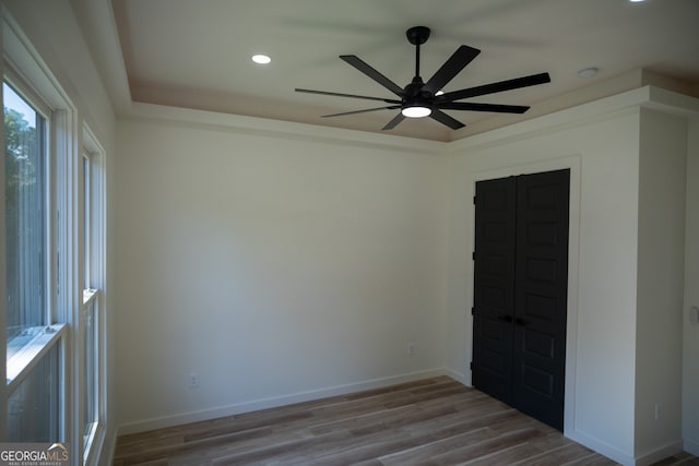 empty room featuring wood-type flooring and ceiling fan