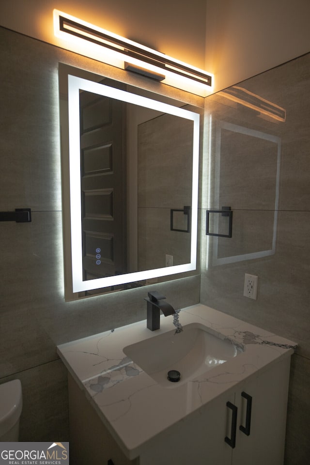 bathroom with vanity and toilet