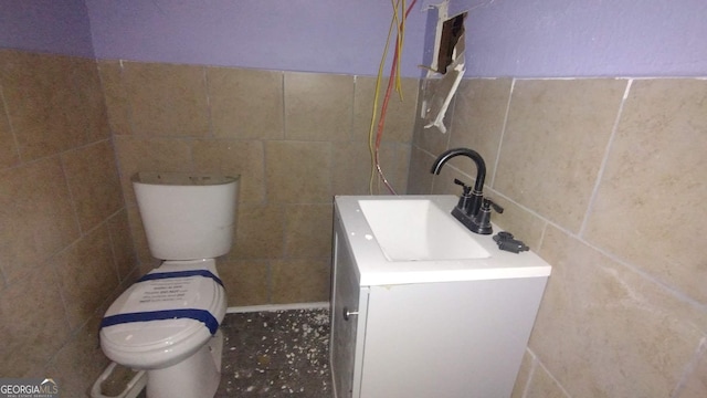 166 Gardner St, Macon, GA 31204 - bathroom with tile walls, toilet, and vanity