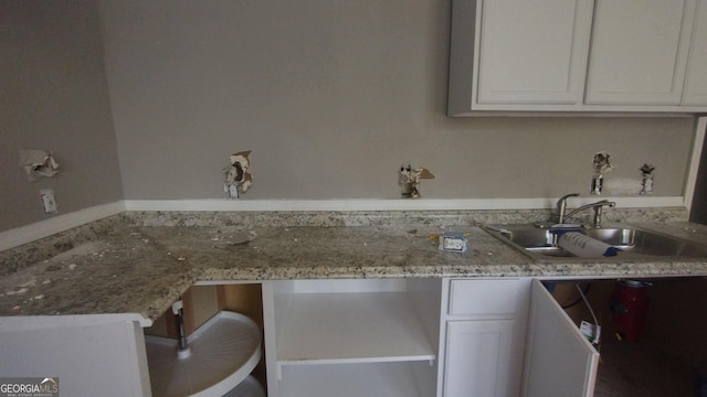 166 Gardner St, Macon, GA 31204 - kitchen featuring white cabinets, a sink, an office area, and light stone countertops