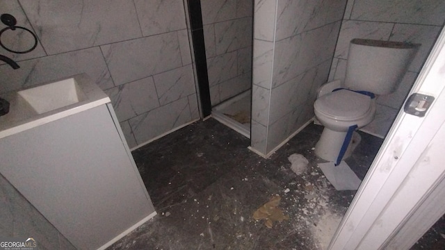 166 Gardner St, Macon, GA 31204 - bathroom with toilet, tile walls, and tiled shower