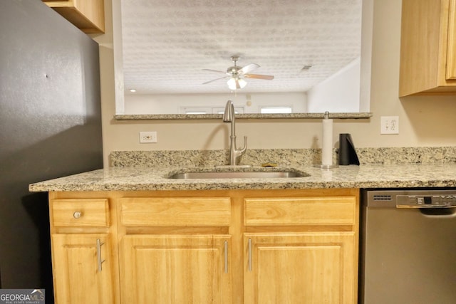 kitchen with light brown cabinets, dishwasher, a textured ceiling, ceiling fan, and sink