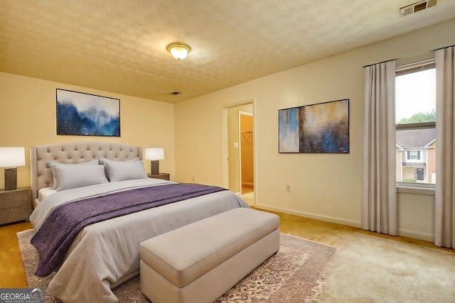 bedroom featuring a textured ceiling