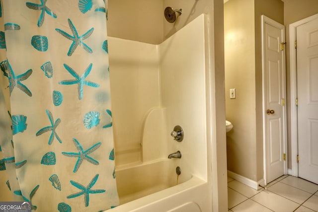 bathroom featuring shower / bathtub combination with curtain and tile patterned flooring