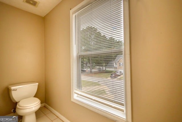 bathroom with tile patterned floors and toilet