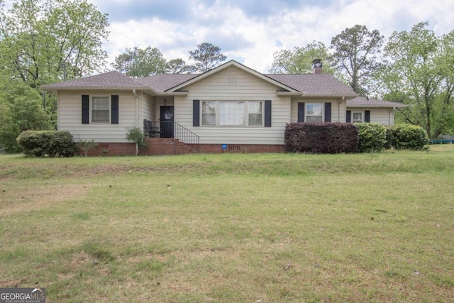 single story home with a front yard