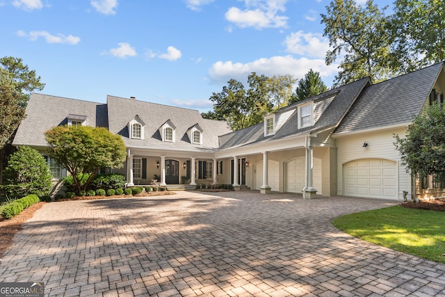 cape cod-style house with a garage