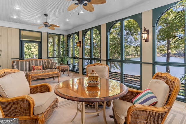 sunroom with ceiling fan and a wealth of natural light