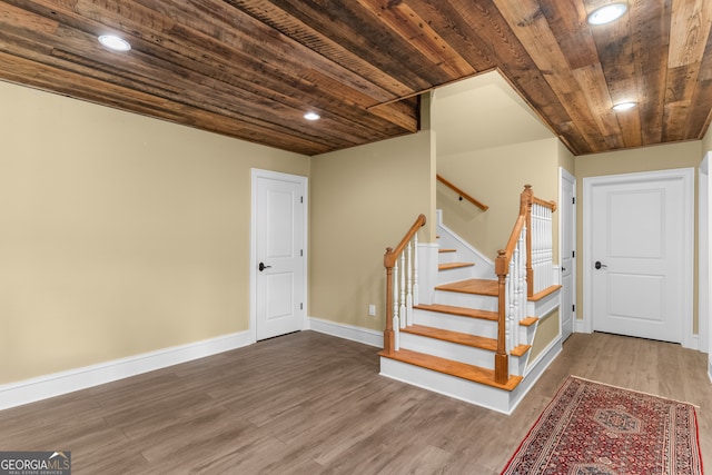 interior space featuring wood-type flooring and wood ceiling