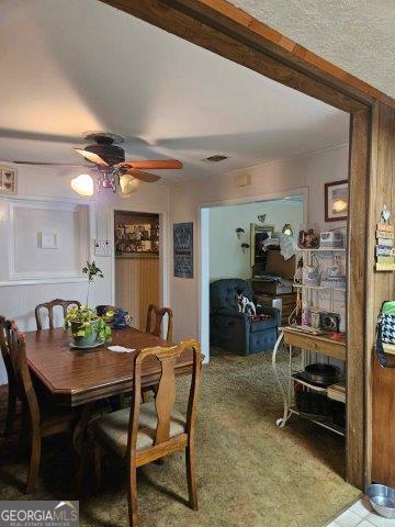 dining space featuring ceiling fan