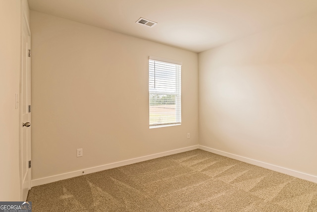 unfurnished room featuring carpet floors