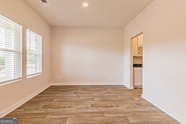 unfurnished room with light hardwood / wood-style floors