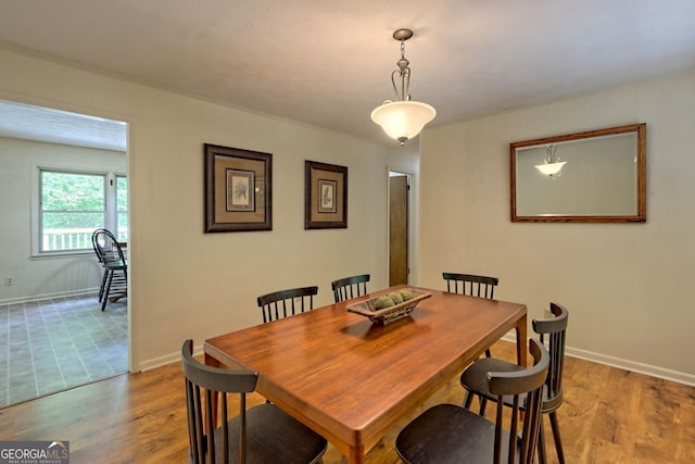 dining area with wood-type flooring