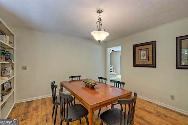 dining area with hardwood / wood-style floors