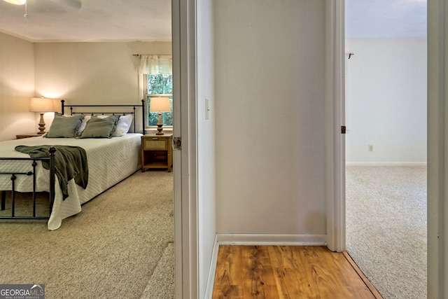 bedroom with ceiling fan and hardwood / wood-style floors