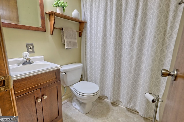 bathroom with vanity, toilet, and curtained shower