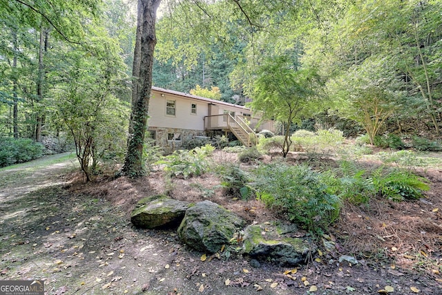 view of yard featuring a wooden deck