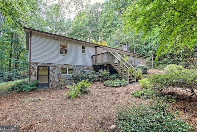 rear view of property with a deck