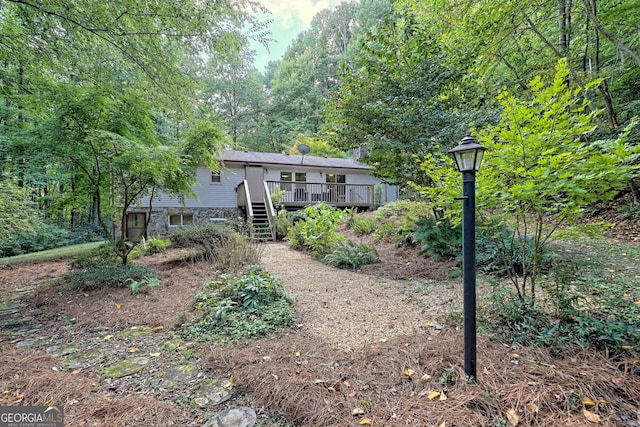 view of yard featuring a wooden deck