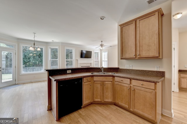 kitchen featuring hanging light fixtures, sink, light hardwood / wood-style flooring, dishwasher, and ceiling fan with notable chandelier