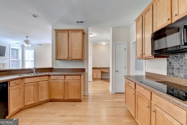 kitchen featuring ceiling fan, sink, backsplash, black appliances, and light wood-type flooring