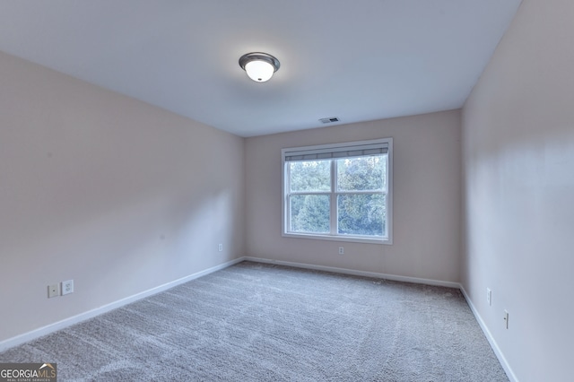 unfurnished room featuring carpet flooring