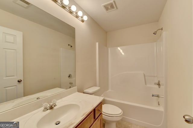 full bathroom featuring vanity, bathing tub / shower combination, toilet, and tile patterned flooring