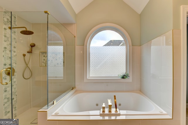 bathroom with independent shower and bath and lofted ceiling