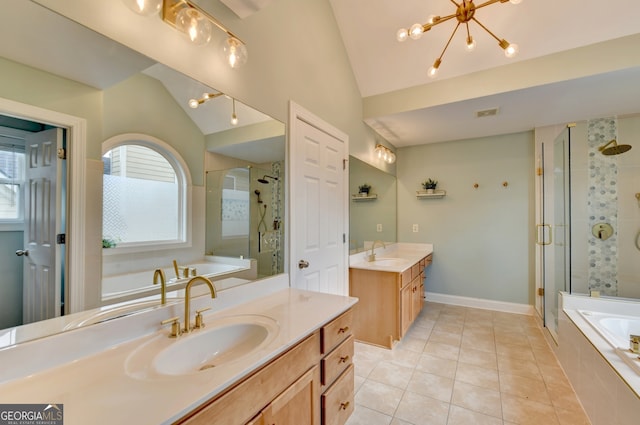 bathroom with vaulted ceiling, a chandelier, vanity, and separate shower and tub