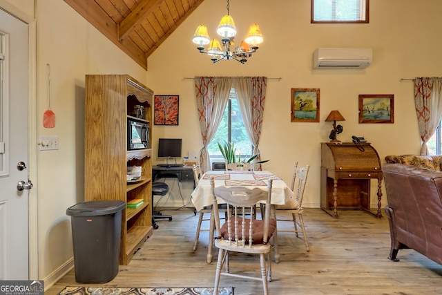 dining area with a notable chandelier, light hardwood / wood-style flooring, high vaulted ceiling, a wall mounted AC, and wooden ceiling