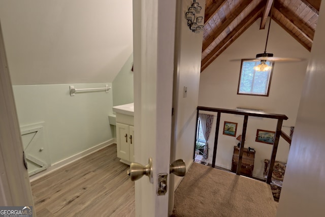 bathroom featuring ceiling fan, vaulted ceiling with beams, vanity, hardwood / wood-style flooring, and wooden ceiling