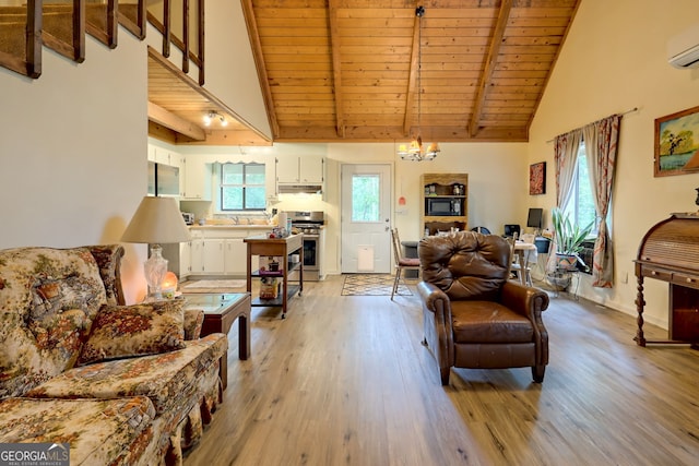 living room with beamed ceiling, light hardwood / wood-style flooring, plenty of natural light, and wooden ceiling