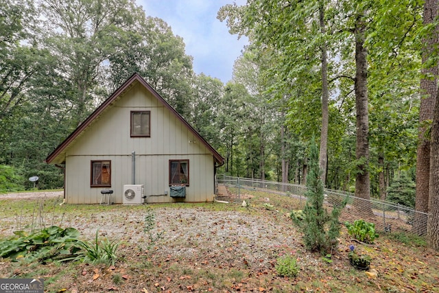 rear view of property with ac unit