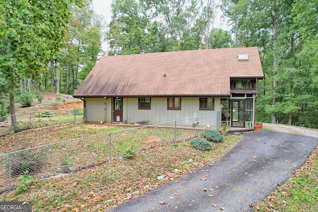 view of front of house with a sunroom