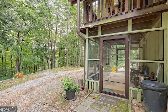 entrance to property featuring a balcony