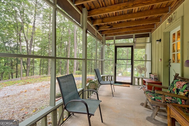 sunroom with beamed ceiling and wooden ceiling