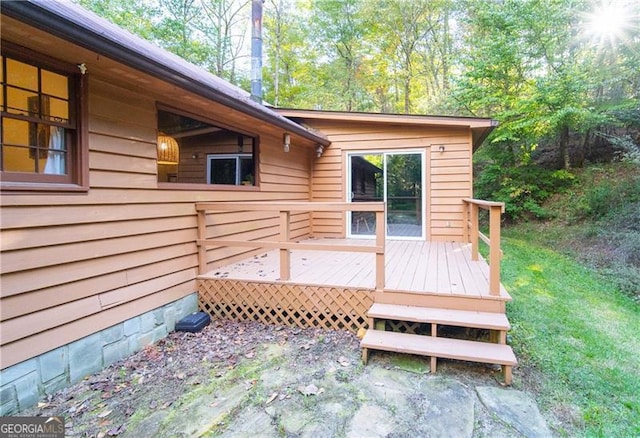 wooden terrace with a yard