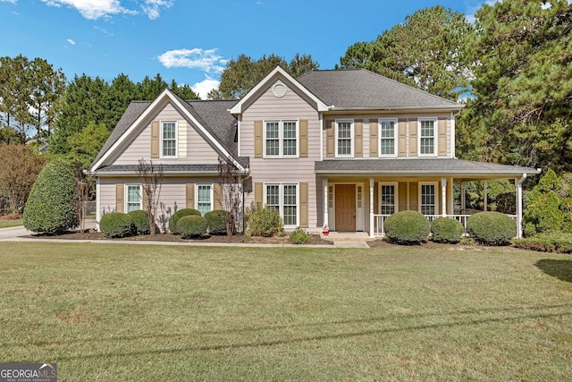 view of front facade featuring a porch and a front lawn