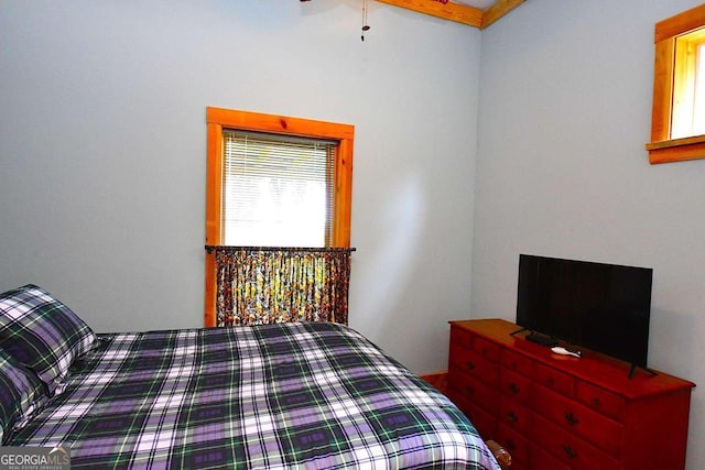 bedroom featuring beam ceiling