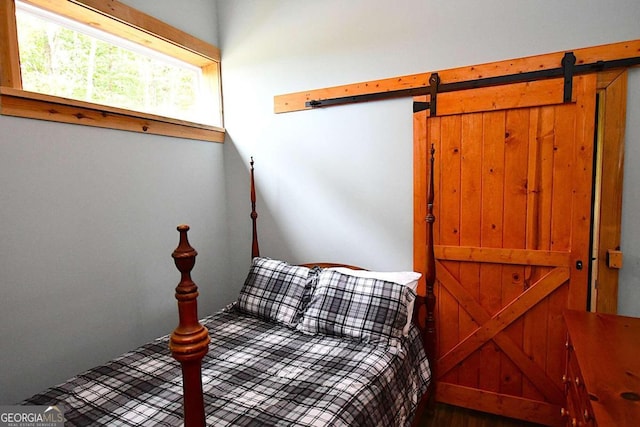 bedroom with a barn door